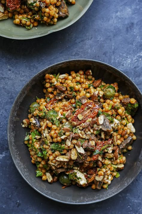 Amatriciana-inspired giant cous cous salad with olives, capers and semi-dried tomatoes