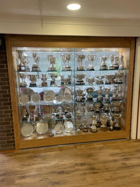 This was a bespoke trophy cabinet for a golf club dividing the meeting room and reception bar area of the golf club. This was so it can be visable from both sides. Faculty Room, Rugby Trophy, Trophy Cabinets, Trophy Display Case, Football Trophy, Hall Cupboard, Trophy Display, Reception Bar, Football Trophies