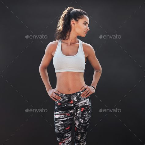 Fit young female model by jacoblund. Portrait of fit young female model standing on black background. Fitness woman standing with her hands on hips and lo... #Affiliate #jacoblund, #Portrait, #fit, #model Female Hands On Hips Reference, Woman Hands On Hips, Hands On Hips Reference, Pose Perspective, Hand On Hip Reference, Background Fitness, Reference Models, Hand On Hip, Model Standing