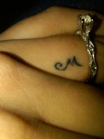 Initial tattoo on ring finger. Of your spouce. Like a monogram saying I am yours and you are mine. My husband would have my first initial and he would have mine. Like this idea, but in white :) Initial Tattoo On Ring Finger, Tattoo On Ring Finger, Tattoo Side, Hidden Tattoos, Ring Finger Tattoos, Initial Tattoo, Ring Tattoos, Finger Tattoo, Wedding Tattoos