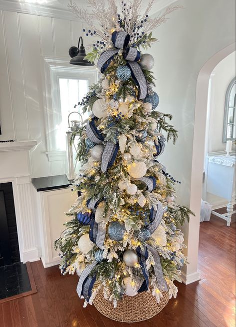 My Christmas Tree is now on sale !! Flocked Christmas tree. King of Christmas Queen Slim Flocked Blue ribbon, blue ornaments Follow my shop @beach_life_living on the @shop.LTK app to shop this post and get my exclusive app-only content! #liketkit #LTKSeasonal #LTKHoliday #LTKhome @shop.ltk https://liketk.it/3WLKs Flocked Coastal Christmas Tree, Decorated Flocked Tree Ideas, Hampton Christmas Tree, Blue Champagne Christmas Tree, Blue And Silver Flocked Christmas Tree, Navy And Blush Christmas Tree, Hamptons Christmas Tree, Blue Themed Christmas Tree Ideas, Blue And Cream Christmas Tree