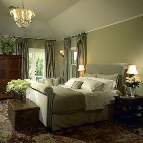 What a glamourous, yet subtle bedroom – everything is traditional in style, yet nothing is stodgy or dull. The monochrome sage-green color scheme is very soothing, with just enough contrast from the area rug, the dark furniture, the ornate ceiling fixture and the many bouquets of flowers around the room. Green Bedroom Walls, Traditional Bedroom Design, Green Bedroom Design, Sage Green Bedroom, Traditional Bedroom Decor, Green Bedroom, Bedroom Master, Bedroom Photos, Traditional Bedroom