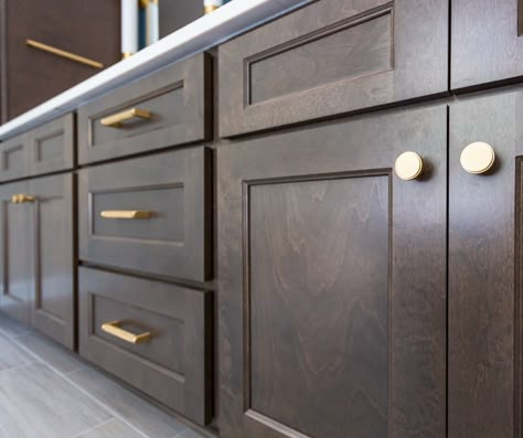 Brass hardware pairs beautifully with the dark cabinets. #dreamhomedesign #carync #raleighnc #customdesigns #interiorideas #bathroomremodel Dark Cabinets With Brass Hardware, Dark Cabinets Brass Hardware, Kitchen Hardware For Dark Cabinets, Cabinet Hardware On Dark Cabinets, Handles For Dark Wood Cabinets, Hardware On Dark Brown Cabinets, Cabinet Handles For Dark Cabinets, Dark Wood Cabinets With Gold Hardware, Handles For Dark Kitchen Cabinets