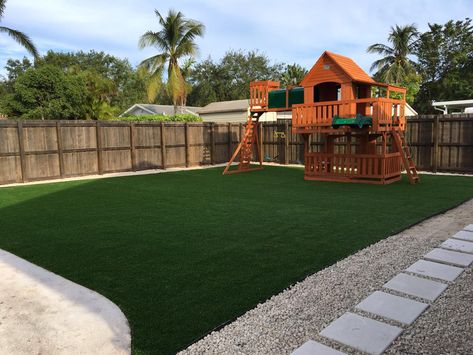 Artificial turf is a top choice for playground surfaces in terms of safety and appearance. It also tends to be a big selling point when it comes time to sell your house. Many people consider it a luxury and a relief from the upkeep that other playground surfaces require. This is why installing synthetic grass at your home will significantly increase the value of your home. It just tends to be very beneficial in the eyes of a homeowner. All Turf Backyard, Artificial Grass Playground Ideas, Outdoor Turf Play Area, Big Backyard Design Ideas, Artificial Turf Play Area, Turf Kids Play Area, Artificial Grass Playground, Artificial Grass Play Area, Backyard Turf Play Areas