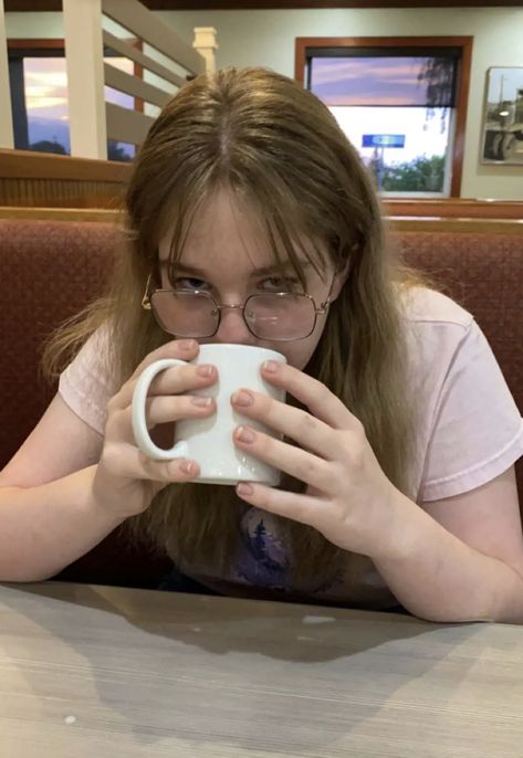 girl posing with a mug Mug Reference, Holding Cup Pose Reference, Person With Glasses Reference, Resting On Table Pose Reference, Holding Cup Pose, Holding Mug Pose, Holding A Teacup Reference, Drinking Coffee Pose Reference, Person Holding Cup Reference