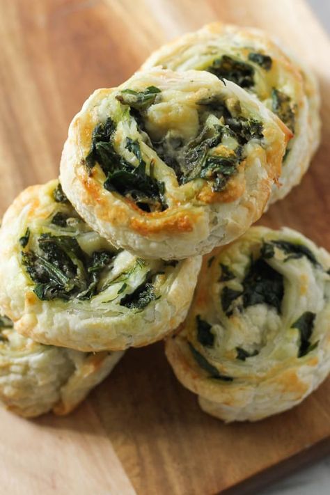 Spinach and Feta Pinwheels made from puff pastry and fresh spinach are great for easy snacks or an appetiser for parties.  These vegetarian spinach and feta scrolls are always a hit with kids and adults alike.  These pinwheels can be made in the oven or the air fryer, and they freeze well, so make a big batch and reheat when you're ready.   #pinwheels #spinachfetapinwheels Spinach And Feta Pastry Rolls, Air Fryer Spinach Recipes, Puff Pastry Recipes Air Fryer, Air Fryer Pinwheels, Air Fryer Puff Pastry Recipes, Feta Pinwheels, Spinach Appetizers, Spinach Roll Ups, Spinach Puff Pastry