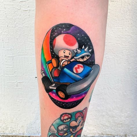 Chris Stockings on Instagram: “MARIO KART! So.. Rainbow Road.. have you mastered it? 👀 Thanks again Natasha. Always a fun piece 🙌🏼 done using @tatsoul Carts and…” Mario Kart Tattoo Ideas, Mario Kart Tattoo, Bowser Tattoo, Toad Mario Kart, Road Tattoo, Rainbow Road Mario Kart, Black Panther Tattoo, 90s Tattoos, Tattoo 2024