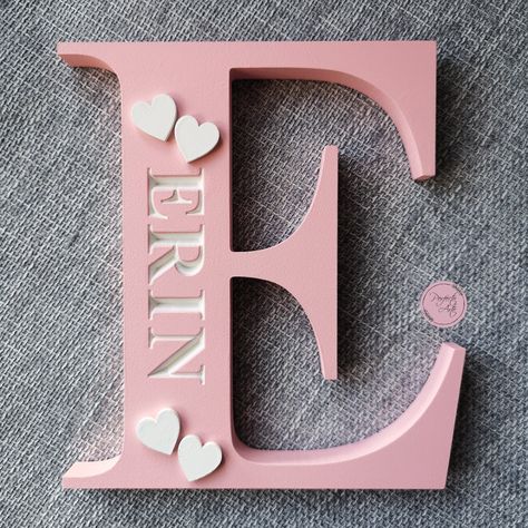 This lovely personalised engraved wooden letter with Times New Roman font name makes excellent gift for nursery decor, birthdays, Christenings, baby shower/new baby and more! It is great shelf decoration to brighten up a nursery, child's bedroom or playroom. The letter is hand sanded and hand painted so there may be noticeable brush strokes. Finally it is finished off with sealer to protect the paint. The engraved name will always be in white. The wooden embellishments (except the moustache whic Wood Name Signs Nursery, Times New Roman Font, New Roman Font, Wooden Embellishments, Wooden Initials, Roman Fonts, Shelf Decoration, Wooden Words, Wood Name Sign