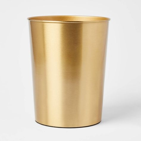 Keep clutter under control while adding a decorative accent to your space with this Antique Wastebasket from Threshold™. This metal wastebasket features a cylindrical silhouette with an open-top design for easy disposal of trash, while the compact size makes it ideal for any room or corner, as well as easy to slide under desks. Showcasing a glossy brass finish, this washroom wastebasket brings rustic-inspired charm to your living space. Boho Trash Can Bedroom, Pink And Gold Bathroom Accessories, Powder Room Accessories, Brewery Bathroom, Cute Trash Can Bedroom, Gold Trash Can Bathroom, Powder Room Waste Basket, Gold Garbage Can, Room Trash Can