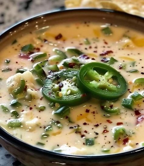 Spicy Jalapeño Popper Soup is a creamy and flavorful dish inspired by the popular jalapeño popper appetizer. This comforting soup combines the heat of diced jalapeños with the richness of cream cheese and heavy cream, creating a luscious and spicy base. Tender shredded chicken adds heartiness, while shredded cheddar cheese melts in for extra creaminess. […] Spicy Jalapeño Popper Soup, Jalapeno Popper Chili, Jalapeño Popper Soup, Avani Recipes, Popper Soup, Jalapeno Popper Appetizer, Jalapeño Soup, Recipes Spicy, White Bean Soup Recipes