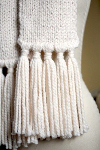 Add Tassels To Blanket, Knitted Blanket Scarf, Add Tassels To Scarf, How To Make Tassels With Yarn For Scarf, Blanket Tassels Diy, Adding Tassels To Scarf, Scarf Ends Ideas, Tassles On Crochet Scarf, How To Make Fringe On A Scarf