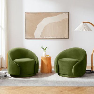 The generous proportions of this set of 2 swivel chairs ensure they are the statement in any space, while their gentle curvature and welcoming boucle or glam velvet upholstery add an unmatched relaxed tone. 360 degree round base allows you to sit on and swivel effortlessly. The accent chair's round silhouette gives it a fun yet elegant feel that is guaranteed to make a gorgeous statement in your living room, bedroom or lounge area. Fabric: Olive Velvet | Barrel Chair - Brayden Studio® Blaklee 34 Cool Living Room Chairs, Sitting Space Ideas, Two Chairs Living Room, Swivel Chairs Living Room Layout, Sitting Room In Bedroom Ideas, Barrel Chairs, Green Swivel Chair Living Room, Green Accent Chair Living Room, Fun Chairs