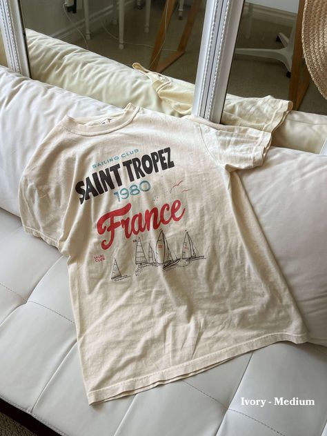 Join the Saint Tropez France Sailing Club - no sailing skills required, just a taste for seaside charm and nostalgic summers. Unisex soft cotton crew neck t-shirt featuring a Saint Tropez France Sailing Club graphic printed on the front. Fabrics: 100% USA cotton, 6.1 oz Made with love in: Los Angeles Ski Ideas, Saint Tropez France, Club Merch, St Tropez France, Graphic Layout, Just A Taste, Print Design Art, City Outfits, Favorite Daughter