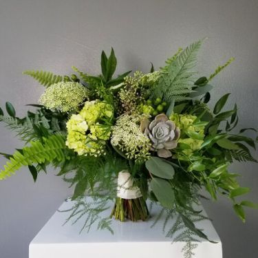 A gorgeous garden styled bouquet featuring a blend of vibrant greenery, succulents and other textures, hand-tied with a ribbon wrapped stem. Perfect for destination weddings, courthouse surprises, and romantic elopements. Lace Hydrangea, Fern Centerpiece, Fern Bouquet, Eucalyptus Wedding Bouquet, Fern Wedding, Green Wedding Bouquet, Green Centerpieces, Greenery Centerpiece, Hydrangea Arrangements