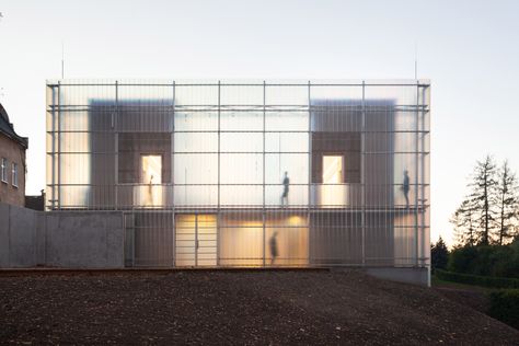 This constrained site led Stolín and Mičeková to develop the concept of breaking down the form of the building while keeping it unified by its outer skin.  "We want children to perceive and learn about architecture through various spatial configurations, which are implemented within the whole composition", they explained. Building Skin, Double Skin, Translucent Glass, The Czech Republic, Glass Facades, Chinese Architecture, Architecture Office, Zaha Hadid, Facade Architecture