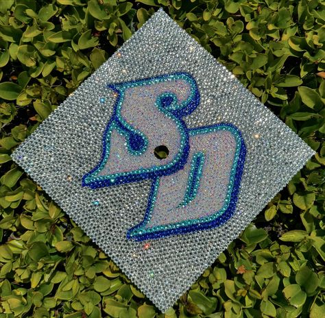 SD💙✨ #grad #gradcap #gradcapdesign #graduation #customgradcaps #rhinestone #bling #sandiego #university #college #handmade #fyp #etsy Senior Things, Cap Graduation, Grad Cap Designs, Grad Caps, University College, Grad Cap, Graduation Cap, Purple And White, High School