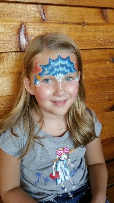 Mermaid face paint perfect for an under the sea birthday . This was done by fanciful facepaint Water Face Painting, Under The Sea Face Paint, Mermaid Face Paint Kids Easy, Ocean Face Paint, Face Paint Mermaid, Mermaid Face Painting, Mermaid Face Paint, Mermaid Tiara, Mermaid Face