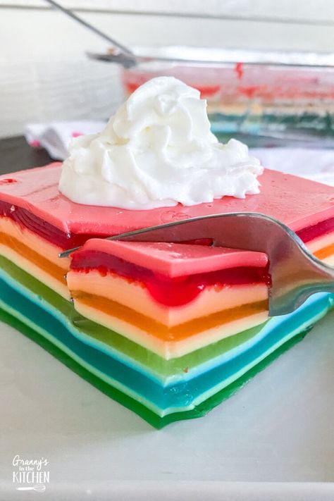 Layers of vibrant colors and flavors make this this vintage rainbow Jello ribbon salad recipe a total crowd pleaser! Ribbon Jello Recipe With Sour Cream, Ribbon Jello Recipe, Ribbon Jello, Rainbow Jello Recipe, Layered Jello Recipe, Jello Cake Recipes, Ribbon Salad, Lime Jello Salads, Rainbow Cake Recipe