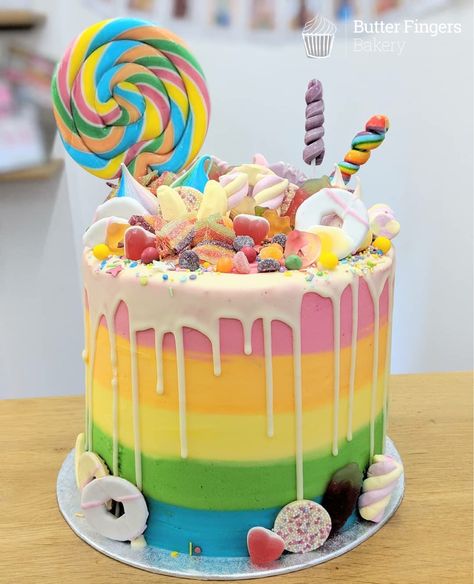 A tall sweetie overload birthday cake #cake #birthday cake #tallcake #rainbowcake #rainbow #colourful #dripcake #buttercreamcake #sweets #candy #sweetieoverload #lollipop #party #kidscake Sweetie Cake, Colorful Birthday Cake, Candyland Cake, Birthday Cake Cake, 7th Birthday Cakes, Lollipop Cake, Butter Fingers, 8th Birthday Cake, Lollipop Party