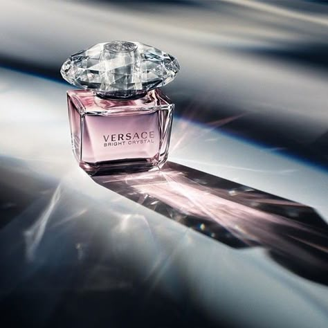 An enthralling and voluptuous fragrance, eloquent, symbolizing the Versace woman who is strong and sure of her charm; sensual and feminine, always glamorous. A woman who loves to be enveloped in a fragrance that delicately reveals colorful and juicy pomegranate grains, iced freshness and shining Yuzu. The beauty of Magnolia, Peonia and Lotus Flower provide voluptuousness and transparency, while vegetal amber is delicately sensual and will delight the senses. #perfume #versace #eaudeperfume Versace Perfume Woman, Versace Crystal Noir Perfume, Versace Fragrance, Versace Perfume, Versace Bright Crystal, Purple Bottle, Perfume Photography, Fragrances Perfume Woman, Bitter Orange