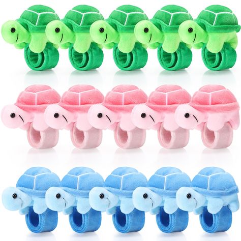 PRICES MAY VARY. Sufficient Quantity: you will receive 15 pieces stuffed turtle slap bracelet party favors in 3 different colors, 5 pieces for each color, which are exquisite and adorable, can easily get people's attention; You can wear them, share with others, or keep them as special bracelet collections Proper Size: the stuffed turtle animal slap bracelets measure about 8.66 inches/ 22 cm, fit comfortably on most wrists without slipping off, making them ideal accessories for most people who lo Turtle Slap, Ocean Themed Party Favors, Sea Turtle Birthday Party, Bubble Guppies Decorations, Sea Party Favors, Cat Bday, Turtle Birthday Party, Stuffed Turtle, Goodie Bag Stuffers