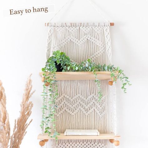 BE BOHO FREE and embrace the laid back, casual chic lifestyle of modern rustic living. macrame wall hanging shelf can elevate any room its hung in .EASY TO HANG indoors or out. Perfect decor piece for the home or apartment. Use our boho shelves in the bedroom, bathroom or dining room, or as wall hanging shelves for plants on the porch . our macrame shelf makes it easy to decorate any space. Beautiful hanging wall shelves for collectibles and photos, books in a dorm, office or a plant wall . Floating Plant Shelf, Boho Shelves, Macrame Wall Hanging Shelf, Macrame Hanging Shelf, Wall Shelf Display, Botanical Display, Wall Hanging Shelf, Indoor Plant Wall, Macrame Shelf