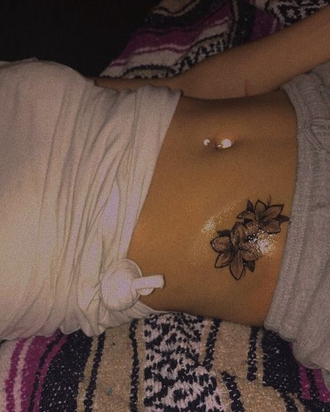 Small Flower Tattoos Black Women, Side Stomach Tattoos Women Flower, Flower Belly Tattoo, Jasmine Flower Tattoo Shoulder, Stomach Tattoo Flowers, Waist Flower Tattoo, Stomach Flower Tattoo, Flower Stomach Tattoos, Small Stomach Tattoos Women