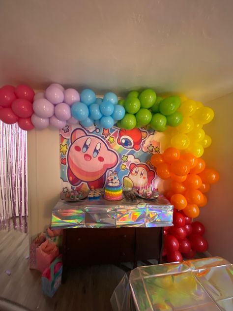 Kirby Cake table with Rainbow balloons Kirby Party Decorations Idea, Kirby Themed Birthday, Kirby Decorations, Kirby Birthday Party Decorations, Kirby Party Ideas, Kirby Party Decorations, Kirby Birthday Party Ideas, Kirby Birthday Party, Kirby Cake