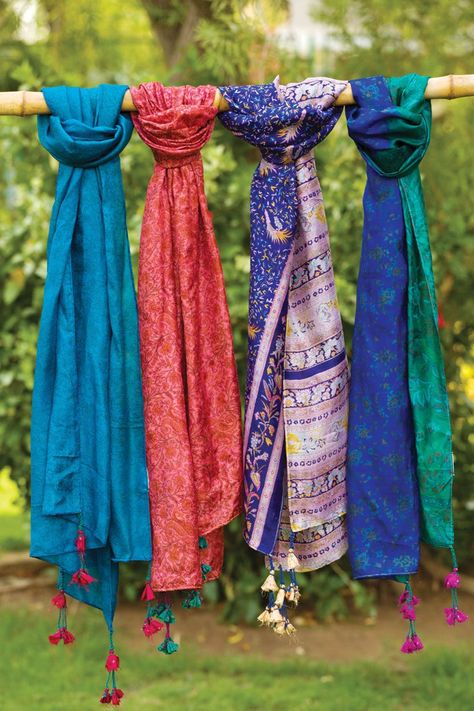 Sevya's Recycled Silk Sari Scarf is handmade by women artisans in India using 100% silk recycled saris. These fair trade silk scarves feature handmade tassels, and come in a wide range of vibrant silk sari prints. Each piece is unique, comes in assorted colors and prints. Dimensions: 20" x 70" Sari Ideas, Sari Scarf, Fabric Scarf, Silk Sari, Women Artisans, Silk Scarves, Repurpose, Fair Trade, Scarf Wrap