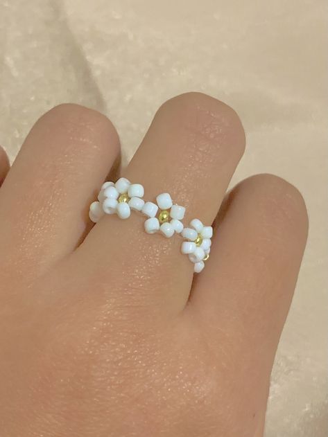 Excited to share the latest addition to my #etsy shop: White and Gold Seed Bead Daisy Chain Flower Ring || colorful and customizable ring || macrame ring band || dainty minimalistic #glass #goldring #whiteandgold #customring #flowerring #seedbeadring #cottagecore #daisychainring #minimalisticring Seed Bead Daisy Chain, Bead Daisy Chain, Diy Bead Earrings, Seed Bead Daisy, Ring Macrame, Bead Daisy, Macrame Ring, Cluster Earring, Wire Jewelry Rings