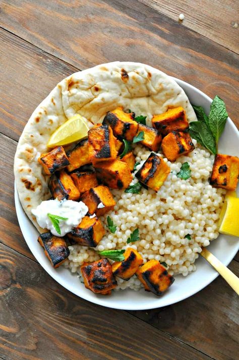 This vegan tandoori tofu is marinated in vegan yogurt and spices. Baked and broiled and served with lemon herb couscous. It is easy, healthy and delicious! Vegan Tandoori, Tandoori Tofu, Herb Couscous, Rabbit And Wolves, Vegan Yogurt, Lemon Herb, Tofu Recipes, Vegetarian Dinner, Tempeh