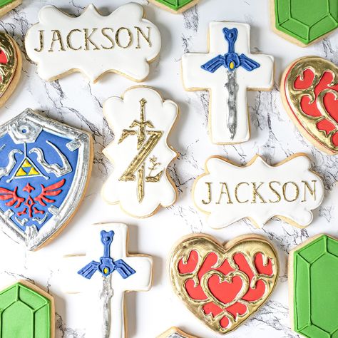 Legend of Zelda cookies. Decorated sugar cookies. Legend of Zelda Breath of the Wild cookies. The Legend Of Zelda Birthday Party, Legend Of Zelda Food Ideas, Zelda Cookies Decorated, Zelda Cookies, Legend Of Zelda Birthday Party Ideas, Zelda Breath Of The Wild Party, Legend Of Zelda Cookies, Zelda Cupcakes, Zelda Breath Of The Wild Cupcakes