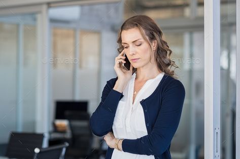 Serious businesswoman talking on phone by Rido81. Serious business woman looking worried while talking on the phone in conference room. Frustrated businesswoman in off... Technology Photos, Call Mom, Talking On The Phone, On The Phone, Print Designs Inspiration, Girl Mom, Job Interview, Listening To You, Job Search