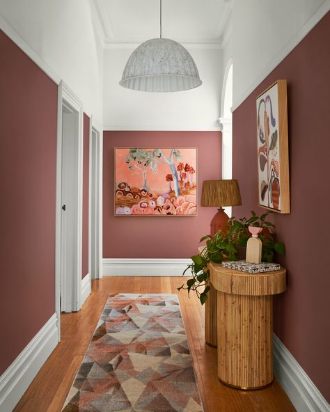 Dulux Terra Rose provides a stark contrast to clean whites, and pairs well with botanicals to soften the overall look.    Stylist: Julia Green Stylist  Photographer: Armelle Habib Photography Hallway Styling, Hallway Paint, Hallway Colours, Aesthetic Interior Design, Hallway Inspiration, Hallway Designs, Narrow Hallway, Hallway Ideas, Entrance Hallway