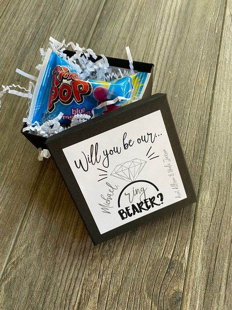 Best Ring Bearer Gifts To Make Him Feel Special- 18 Fantastic Choices Ring Pop Proposal, Ring Bearer Ring Security, Ring Security Ring Bearer, Security Ring Bearer, Security Ring, Groomsman Proposal Box, Ring Bearer Proposal, Groomsmen Proposal Gifts, Ring Bearer Flower Girl