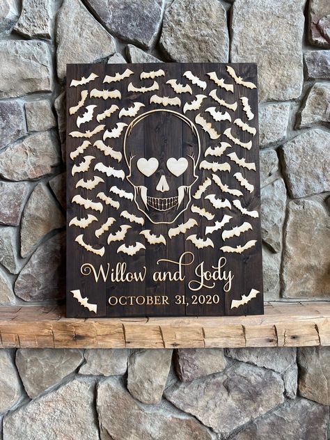 Happy Wedding Day Willow & Cody!! Our Halloween themed Guestbook Alternative where guests sign a bat . . #guestbookalternative #halloweenguestbook #halloweenguestbookideas #bats #skull #themedwedding #spooky #halloweenwedding Halloween Guest Book Ideas, Gothic Wedding Guest Book Ideas, Skull Guest Book Wedding Ideas, Spooky Wedding Guest Book, Spooky Wedding Signs, Pumpkin Wedding Guest Book, Spooky Wedding, Guest Book Ideas, Halloween Themed Wedding