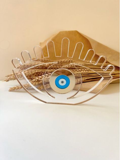 A Handmade Evil Eye Charm Ornament with long eyelashes in transparent color that can protect your house or your working place from the bad luck as we are used to say in Greece. Its size is Large and the Evil Eye can protects and decorates every place at the same time. Find it only at Christina Christi Store. Eye Ornament, Evil Eye Art, Handmade Evil Eye, Turkish Eye, Eye Decor, Long Eyelashes, Bad Luck, Longer Eyelashes, Evil Eye Charm