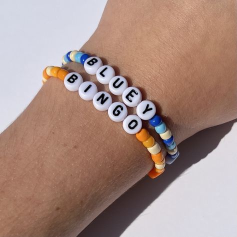 Bracelets inspired by the show Bluey! 💙🧡 Care Bear Bracelet, Obx Clay Bead Bracelet Ideas, Clay Bead Bracelet Ideas Lilo And Stitch, Friends Bracelets Tv Show, Disney Braclets Ideas, Bracelet Making Ideas Clay Beads, Bestie Bracelet Ideas, Bluey Bracelet Ideas, Bead Friendship Bracelet Ideas