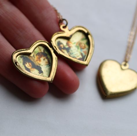 An beautiful pair of vintage lockets, both with space inside for photographs and treasures! This adorable little heart shaped necklace features one larger gold locket, with another tiny little heart locket as a charm! Both lockets have perfectly working hinges and clasps. The larger locket measures only 25mm (one inch) across and is made from solid brass. The smaller locket is only 8mm (very tiny) and is decorated with a vintage copper love heart in a rosy pink, and some delicate gold plated cha Heart Necklace Locket, Jewellery Aesthetic, Large Locket, Necklace Locket, Engraved Locket, Gold Heart Locket, Silk Purse, Girls Heart, Book Locket