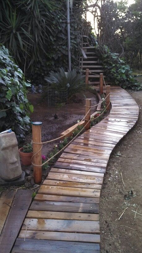 My husband's beautiful new walk way he made out of scrap word from pallets Pallet Walkway, Wood Walkway, Walkway Landscaping, Walkways Paths, Fence Decor, Have Inspiration, Backyard Fences, Garden Pathway, Pallet Wood