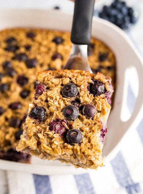 This blueberry baked oatmeal is studded with blueberries and naturally sweetened with bananas and pure maple syrup. Can be made with fresh or frozen blueberries! Gluten-free and vegan-friendly. #bakedoatmeal #blueberry #oatmeal #vegan #glutenfree Baked Blueberry Oatmeal, Healthy Pantry Staples, Blueberry Baked Oatmeal, Blueberry Oatmeal Bake, Oatmeal Bake, Baked Oatmeal Healthy, Eating Bird Food, Healthy Pantry, Baked Oatmeal Recipes