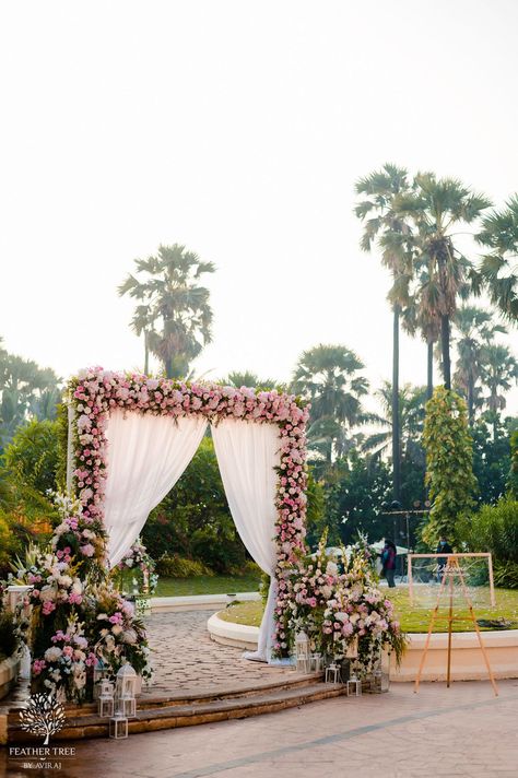 An Intimate Mumbai Wedding With A Gorgeous Glass Mandap! Reception Hall Entrance Decoration, Pastel Wedding Entrance, Entrance Gate Decoration For Event, Bridal Entrance Decoration, Shaadi Entrance Decor, Minimal Wedding Decor Indian, Outdoor Wedding Entrance Decor, Reception Gate Decoration, Bride Entrance Decoration