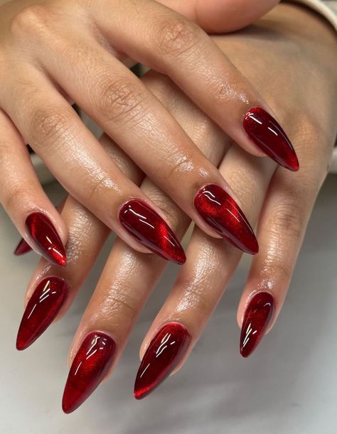 Moody Red Nails, Red Opal Nails, Christmas Nails Sharp, Dark Magnetic Nails, Glassy Red Nails, Iridescent Red Nails, Red Aura Nails With Chrome, Glass Nails Red, Chappell Roan Inspired Nails