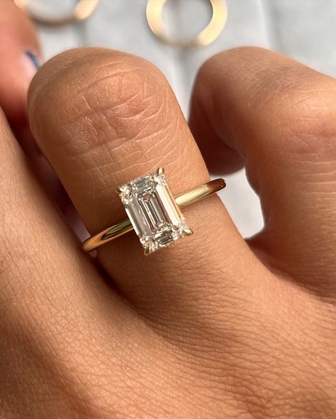 Our Aviva Solitaire Engagement Ring customized with an emerald cut diamond 💎 • • #finejewelry #engagement #enagementring #solitaireengagementring #emearldcut #gold #ring #rings💍 #engagementringinspo Emerald Ring On Hand, Gold Emerald Cut Diamond Ring, Emerald Cut Gold Diamond Ring, Emerald Gold Band Engagement Ring, Solitaire Rectangle Engagement Ring, Emerald Cut Engagement Ring 3 Carat, Emerald Cut Gold Band Engagement Ring, Gold Band Emerald Cut Engagement Ring, Engagement Rings Emerald Cut Gold