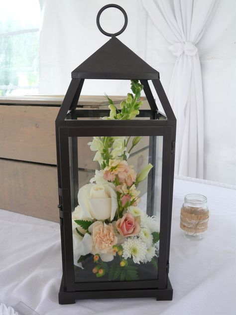 could hang on my shepherd's hooks wtih flowers inside?? Black Lantern Centerpiece, Lantern With Flowers, Lanterns With Flowers, 50th Wedding Anniversary Decorations, Pearl Centerpiece, Wedding Anniversary Decorations, Lantern Ideas, Lantern Centerpieces, Mason Jar Flowers