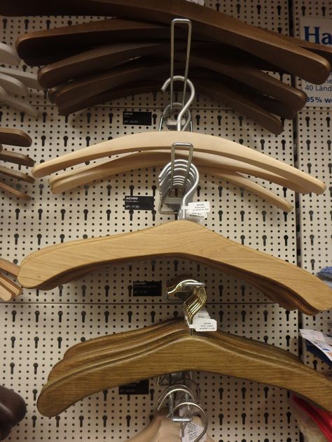 hangers in Switzerland furniture store Play Wood, Closet Hangers, Clothing Store Interior, India Design, Clothes Stand, Hanger Design, Modern End Tables, Wooden Pegs, Store Interior