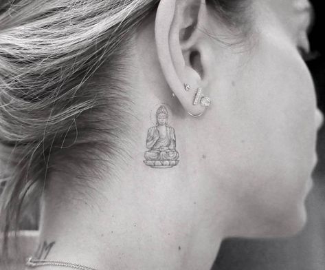 Buddha tattoo behind the right ear. Tattoo Buddha, Buddhist Symbol Tattoos, Buddha Tattoo Sleeve, Tattoo Fairy, Hindu Tattoos, Behind Ear Tattoos, Buddhist Tattoo, Buddha Tattoo Design, Buddha Tattoos