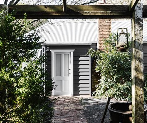 Two renovators from Melbourne put a lot of love and hard work into restoring the old country cottage they visit in Trentham most weekends. White Cottage Exterior, Wood Burning Heaters, French Living Rooms, Modern Country Style, Small Cottages, Backyard Studio, Cottage Exterior, Minimalist Home Interior, Farm Cottage