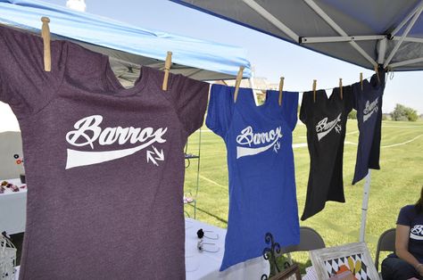 Hanging shirts for display!                              … How To Display Shirts For Sale Craft Fairs, Vendor Shirt Display, Tshirt Booth Display Ideas Vendor, Tshirt Display Ideas Booth, Clothing Booth Display, Vendor Table Display, Bath Bomb, T-shirt Display, Tshirt Display