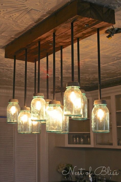 DIY manson jar chandelier wedding decor ideas ขวดโหล Mason Jar, Diy Luminaire, Jar Chandelier, Mason Jar Chandelier, Diy Mason Jar, Rustic Industrial Decor, Deco Luminaire, Versace Home, Mason Jar Lighting